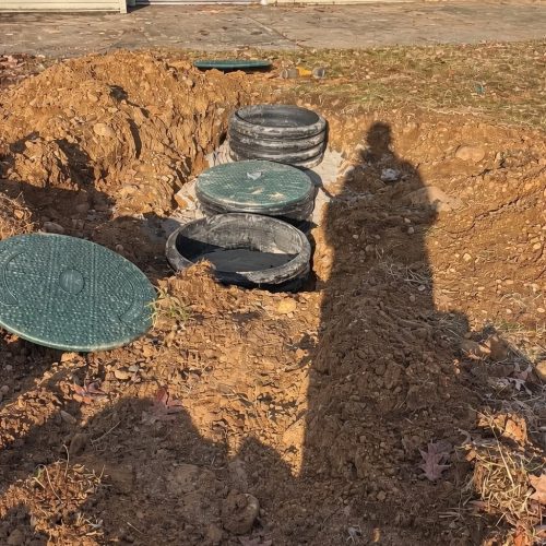 Upgraded this septic system by installing risers to bring access up to grade.